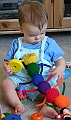 Baby playing with rainbow caterpillar