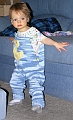 Duck Overalls - Toddler wearing them at home, standing