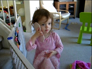 Peo talking on a pretend phone.
